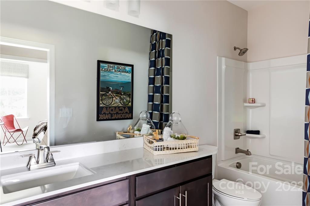 535 Madison Falls Court Fort Mill, SC 29708 - Photo 21 of 28 a bathroom with a sink and a mirror