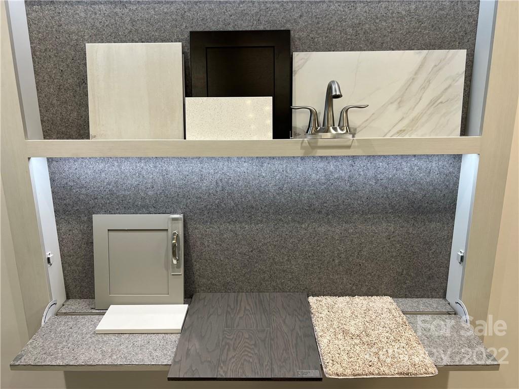 535 Madison Falls Court Fort Mill, SC 29708 - Photo 27 of 28 a bathroom with a sink and a mirror