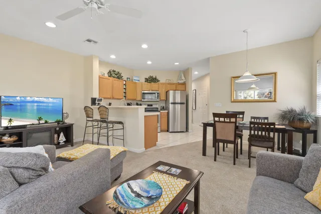 a kitchen with a sink appliances and cabinets
