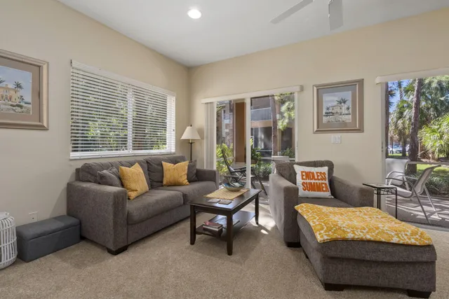 a view of an outdoor dining space with a patio
