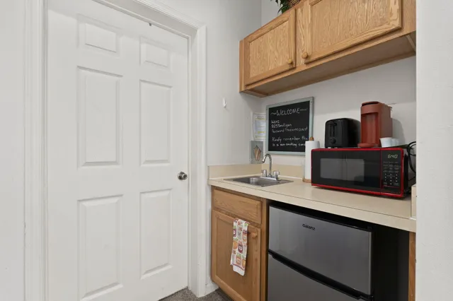 a view of an house with backyard porch and sitting area