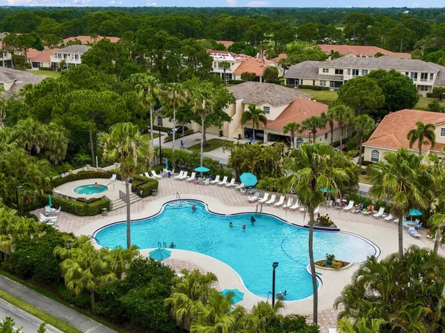 a view of a swimming pool with a sitting area