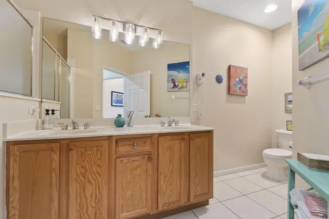 a bathroom with a sink double vanity and a mirror