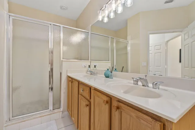 a bathroom with a sink mirror and toilet