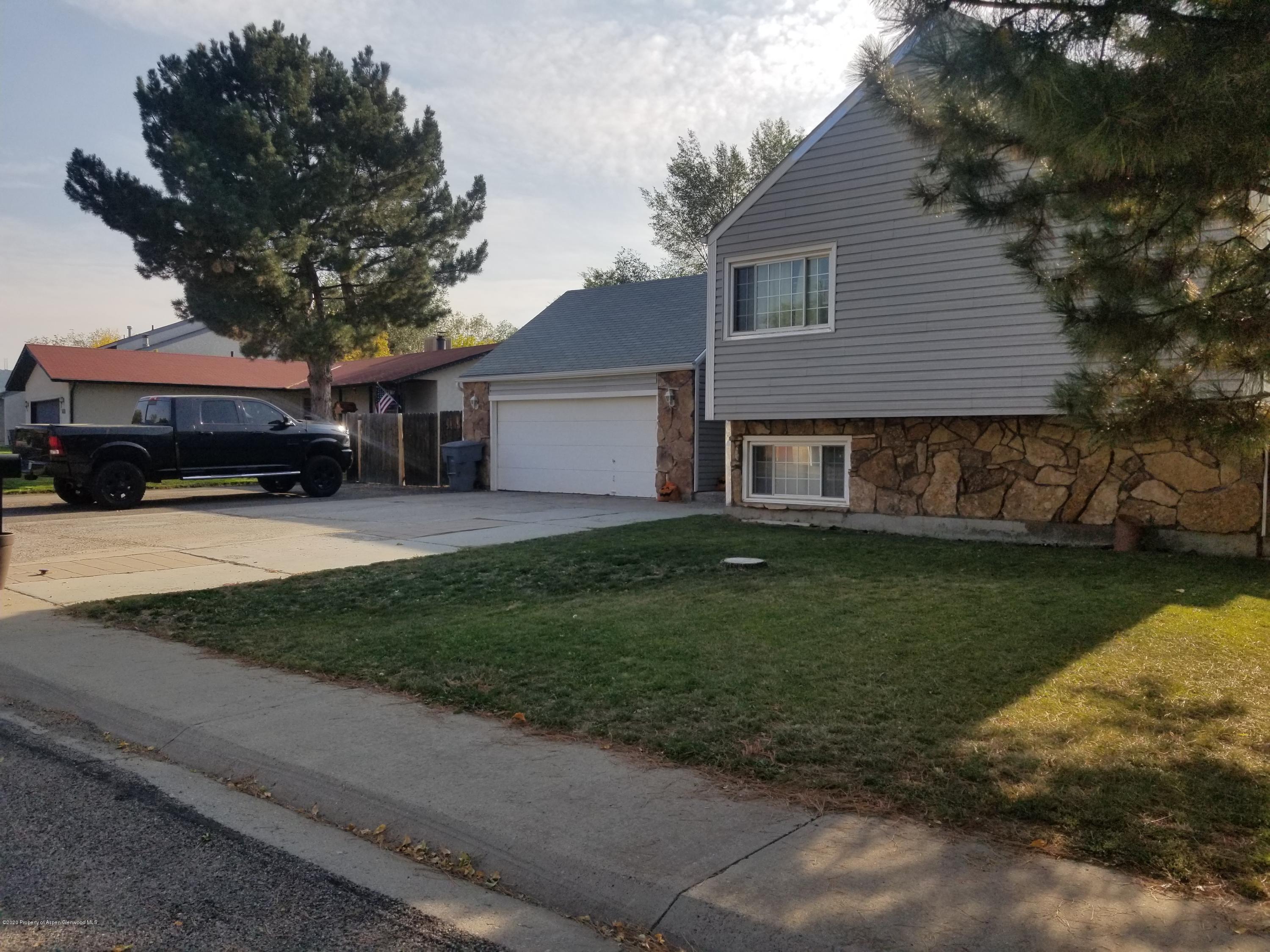 783 Cedar Court Rifle, CO 81650 - Photo 1 of 17 a house view with a garden space