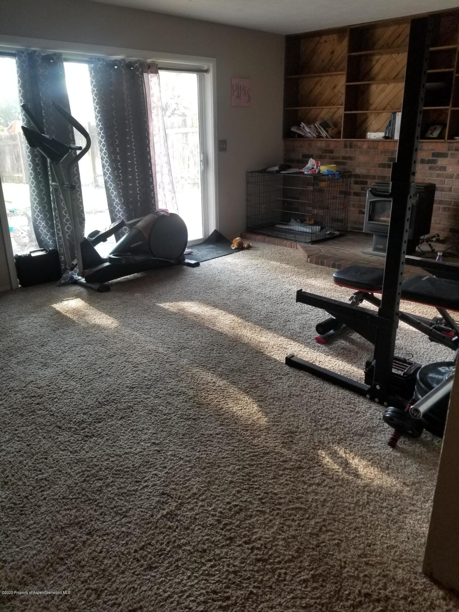 783 Cedar Court Rifle, CO 81650 - Photo 15 of 17 a room with gym equipment and a window