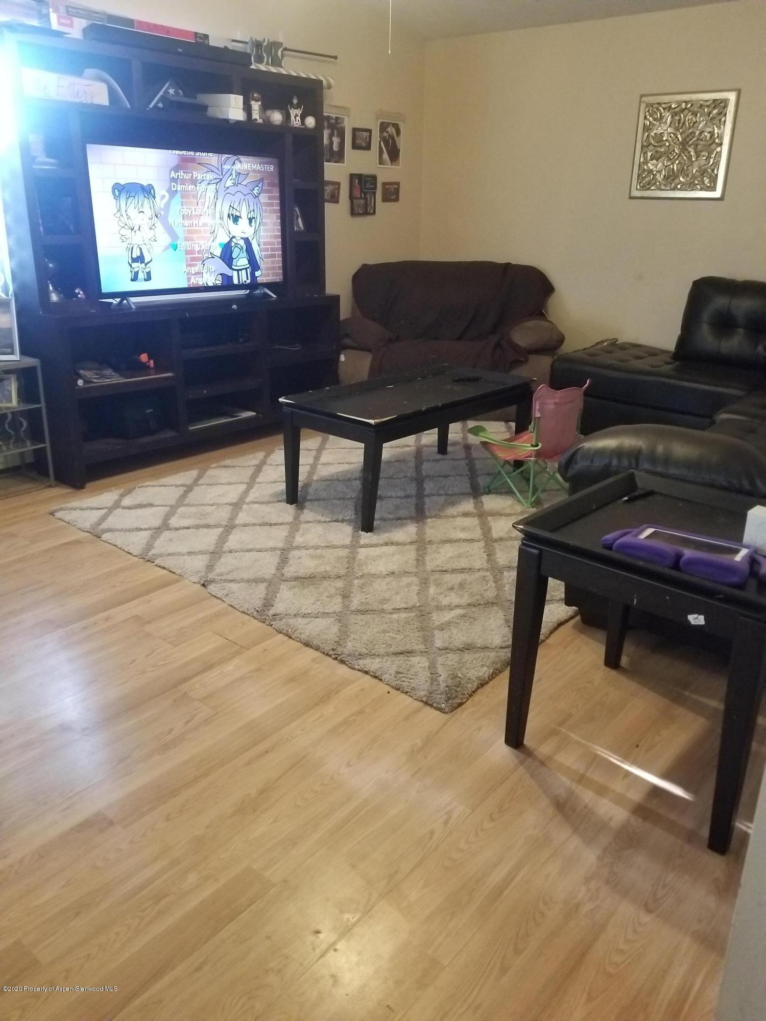 783 Cedar Court Rifle, CO 81650 - Photo 3 of 17 a living room with furniture and a flat screen tv