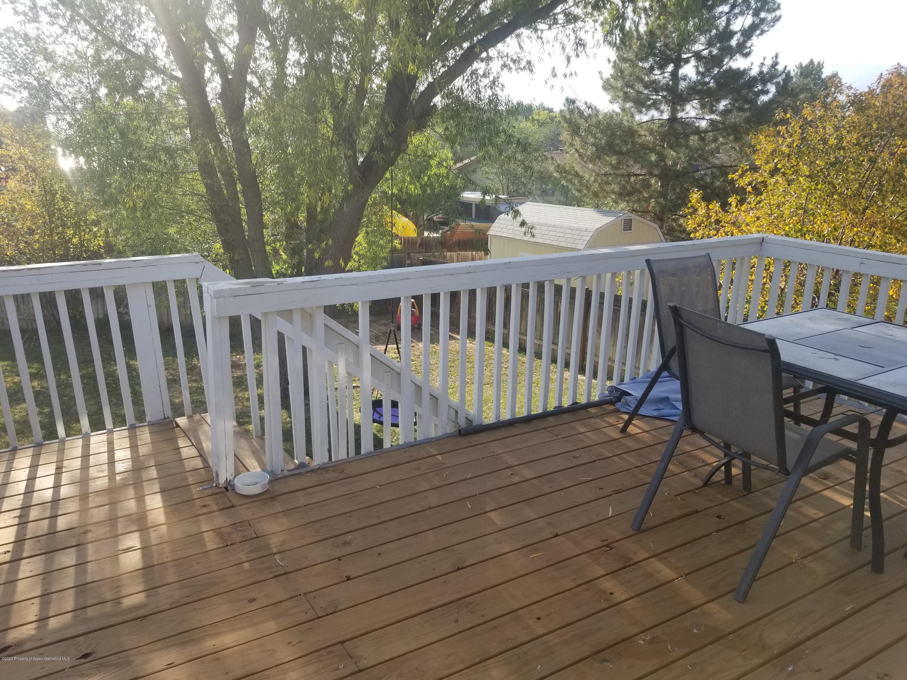 783 Cedar Court Rifle, CO 81650 - Photo 5 of 17 a view of balcony with wooden floor and fence