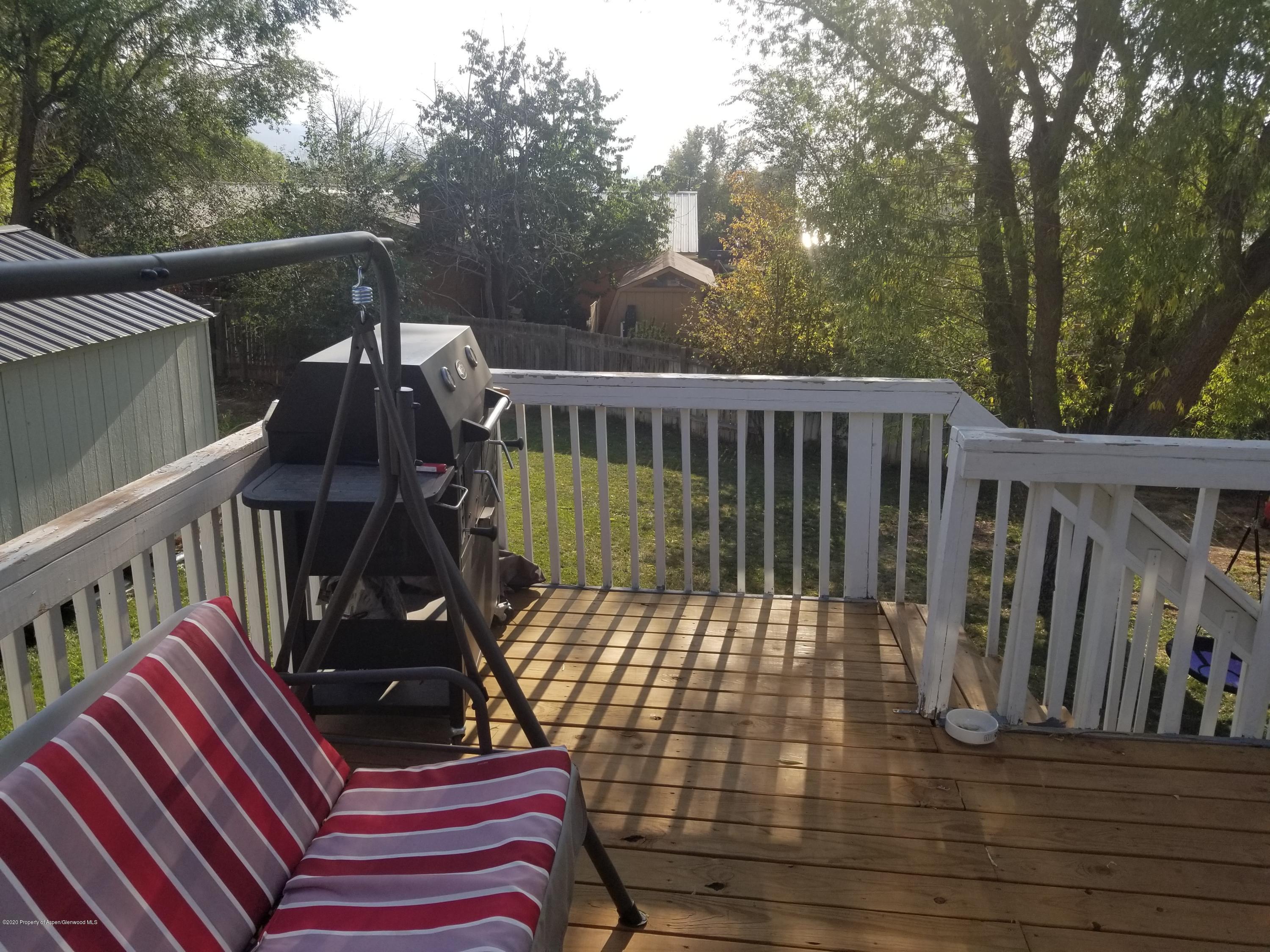 783 Cedar Court Rifle, CO 81650 - Photo 6 of 17 a view of deck with wooden floor and chair