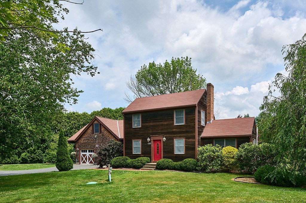 410 Hadley Road Sunderland, MA 01375 - Photo 1 of 32 a front view of a house with garden