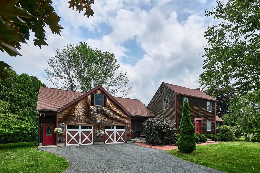 410 Hadley Road Sunderland, MA 01375 - Photo 2 of 32 a front view of a house with garden