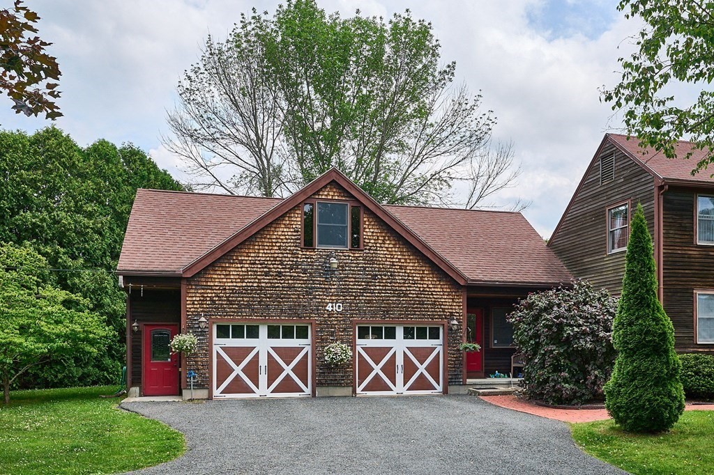 410 Hadley Road Sunderland, MA 01375 - Photo 21 of 32 a front view of a house with garden
