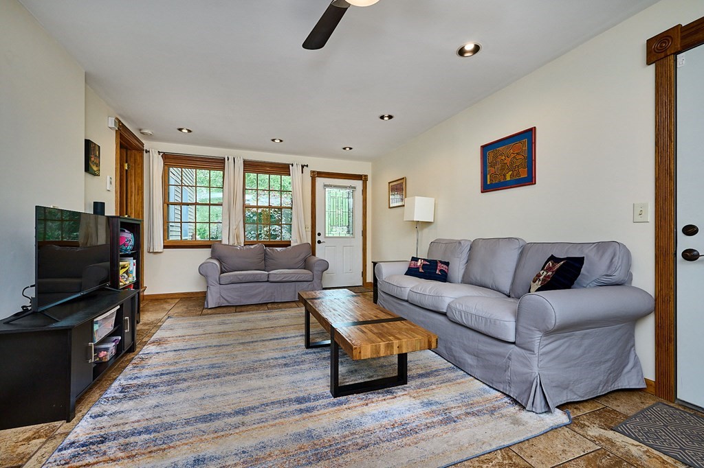 410 Hadley Road Sunderland, MA 01375 - Photo 4 of 32 a living room with furniture and a flat screen tv