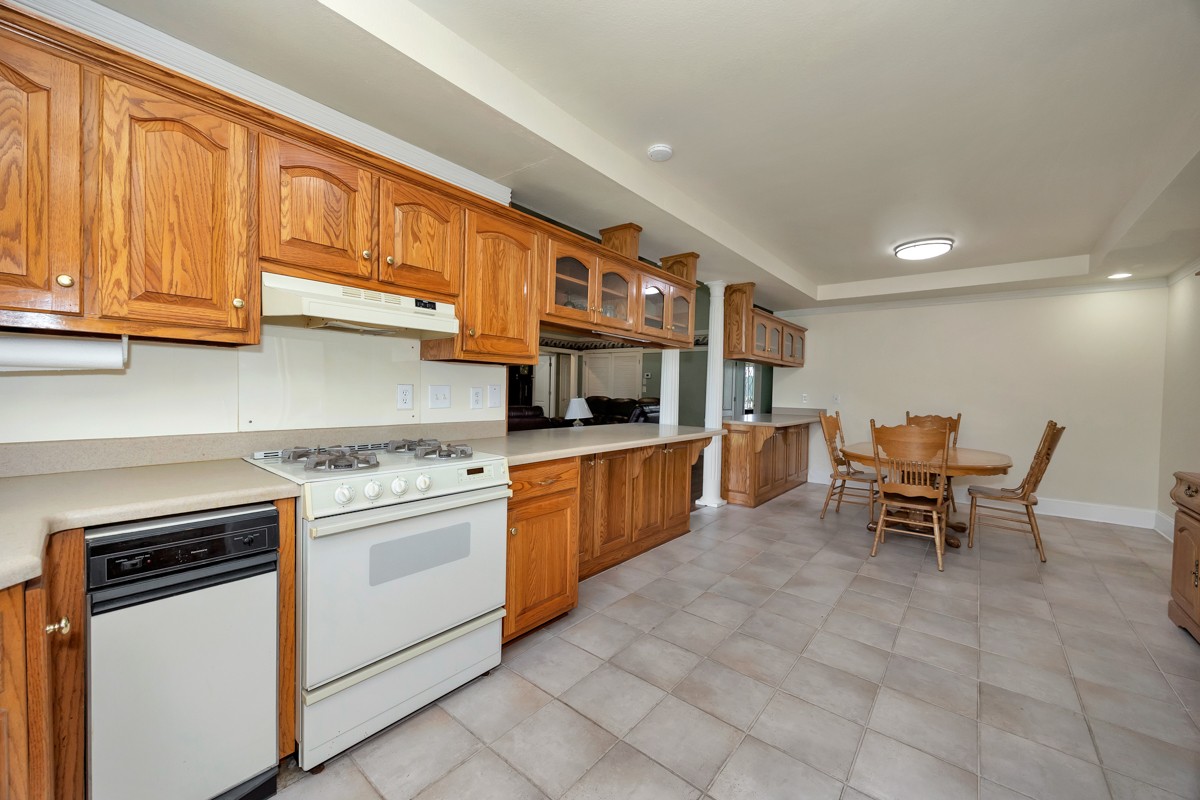 27615 Shannon Road Ardmore, AL 35739 - Photo 13 of 49 a kitchen with stainless steel appliances granite countertop a stove top oven a sink dishwasher and white cabinets