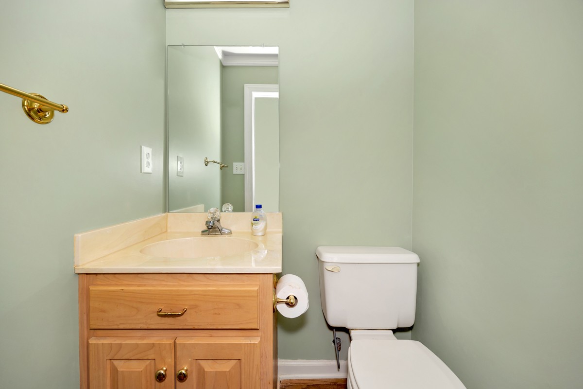 27615 Shannon Road Ardmore, AL 35739 - Photo 24 of 49 a bathroom with a toilet sink and mirror
