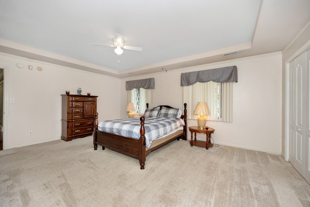 27615 Shannon Road Ardmore, AL 35739 - Photo 26 of 49 a bedroom with a bed and a chandelier