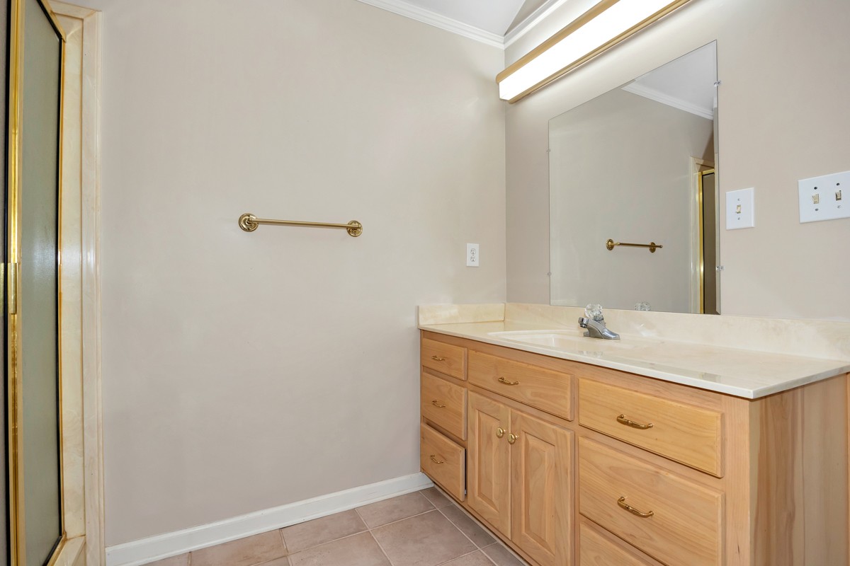 27615 Shannon Road Ardmore, AL 35739 - Photo 28 of 49 a bathroom with a granite countertop sink and mirror
