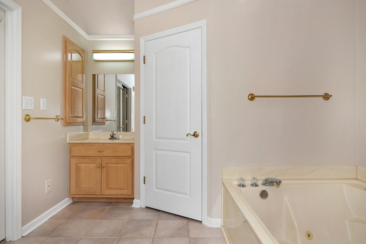 27615 Shannon Road Ardmore, AL 35739 - Photo 29 of 49 a bathroom with a bathtub and a sink