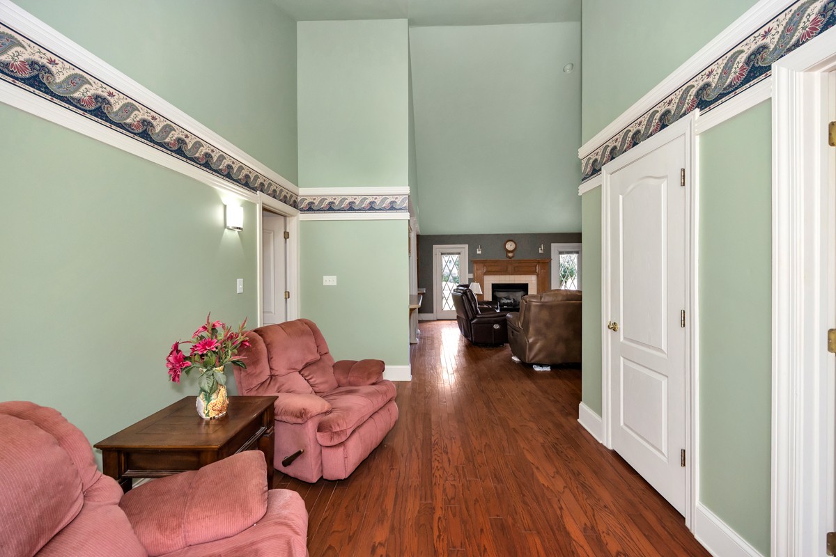 27615 Shannon Road Ardmore, AL 35739 - Photo 3 of 49 a living room with furniture and a chandelier
