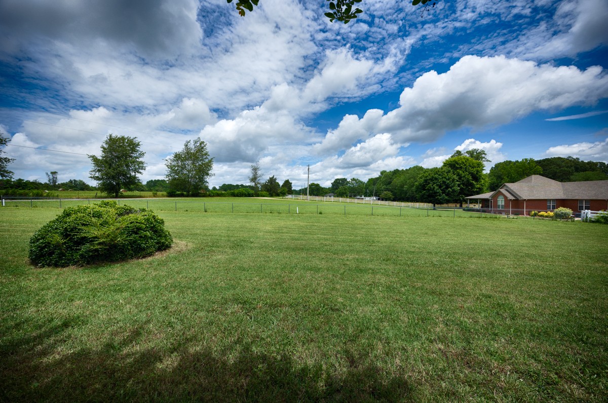 27615 Shannon Road Ardmore, AL 35739 - Photo 38 of 49 a view of a green field with wooden fence