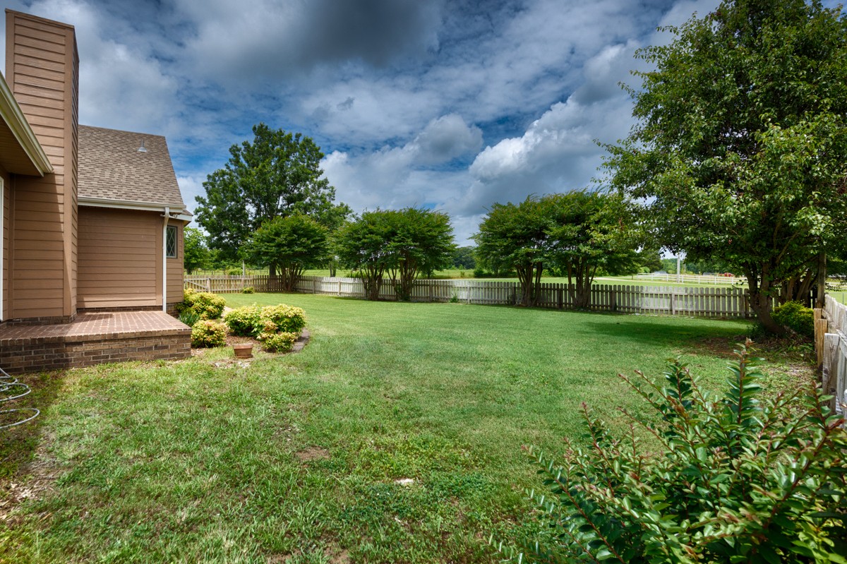 27615 Shannon Road Ardmore, AL 35739 - Photo 40 of 49 a view of a backyard with a garden and entertaining space