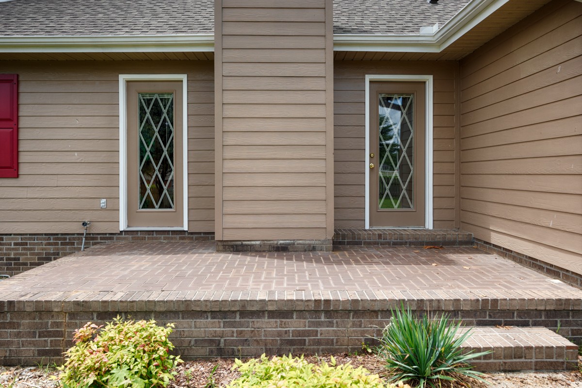 27615 Shannon Road Ardmore, AL 35739 - Photo 41 of 49 a front view of a house with a yard and garage