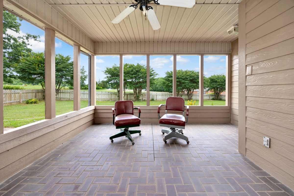27615 Shannon Road Ardmore, AL 35739 - Photo 42 of 49 a living room filled with furniture and a floor to ceiling window