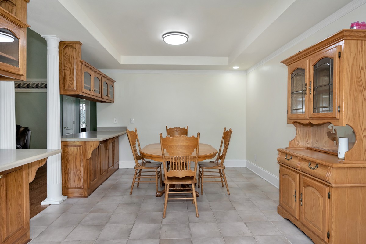 27615 Shannon Road Ardmore, AL 35739 - Photo 9 of 49 a view of a kitchen with a dining table and chairs