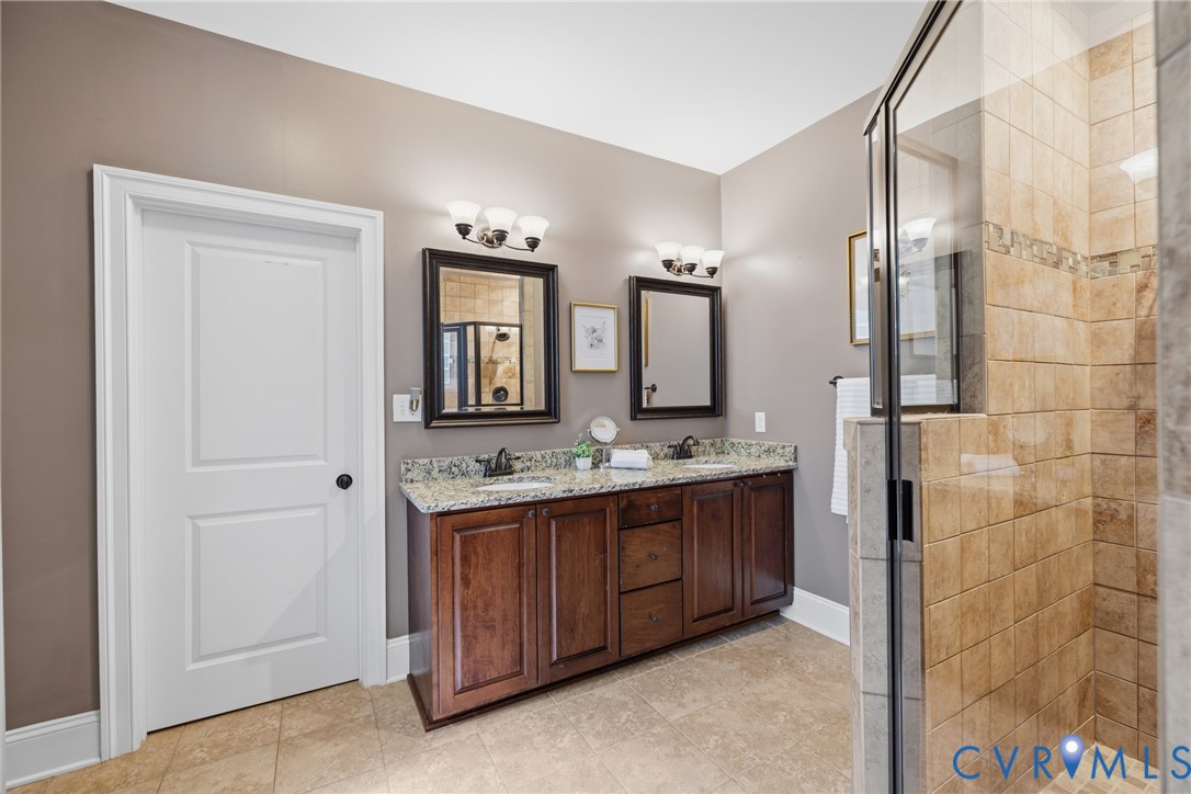 8825 First Branch Lane Chesterfield, VA 23838 - Photo 17 of 49 a bathroom with a double vanity sink and mirror