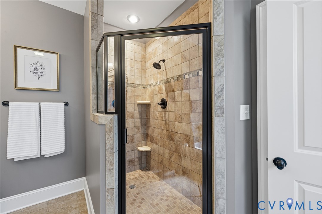 8825 First Branch Lane Chesterfield, VA 23838 - Photo 19 of 49 a bathroom with a glass shower door