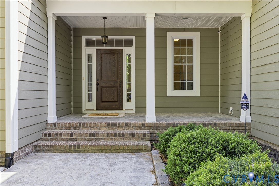 8825 First Branch Lane Chesterfield, VA 23838 - Photo 2 of 49 a front view of a house with a yard
