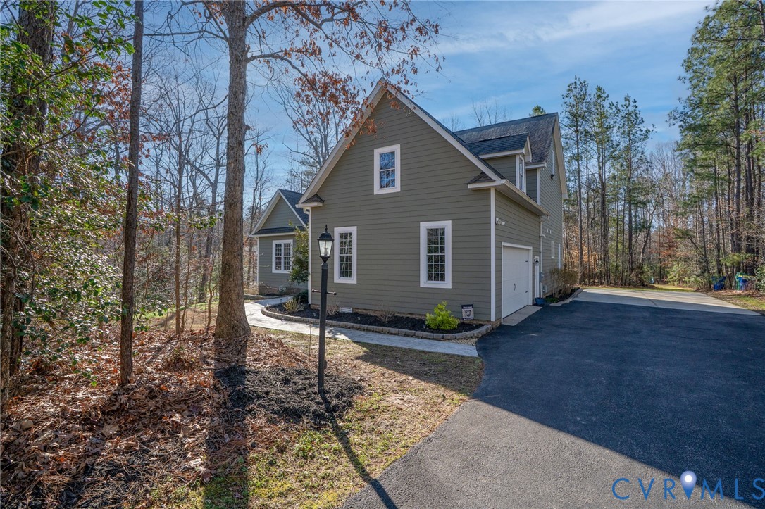 8825 First Branch Lane Chesterfield, VA 23838 - Photo 43 of 49 a front view of a house with garden