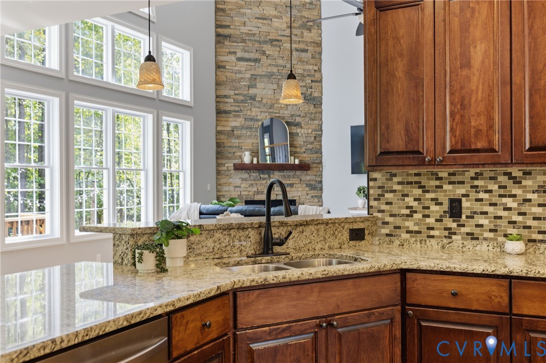 8825 First Branch Lane Chesterfield, VA 23838 - Photo 7 of 49 a kitchen with granite countertop a sink and a window