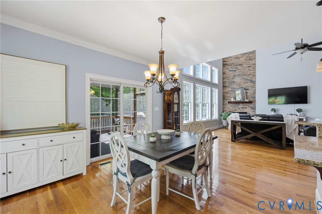 8825 First Branch Lane Chesterfield, VA 23838 - Photo 10 of 49 a view of a dining room with furniture window and wooden floor