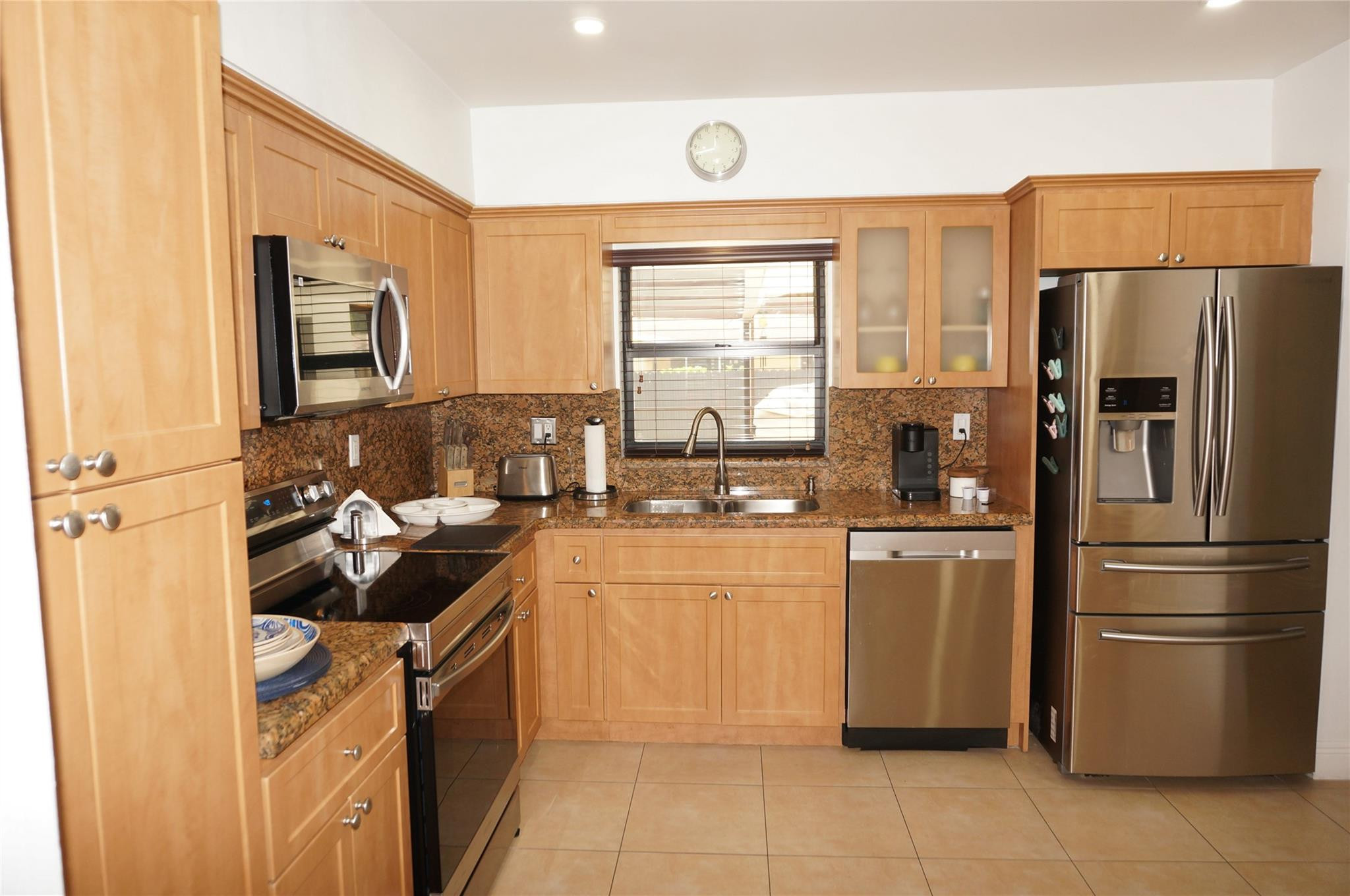 9220 Southwest 56th Street Miami, FL 33165 - Photo 11 of 23 a kitchen with stainless steel appliances granite countertop a refrigerator stove and sink
