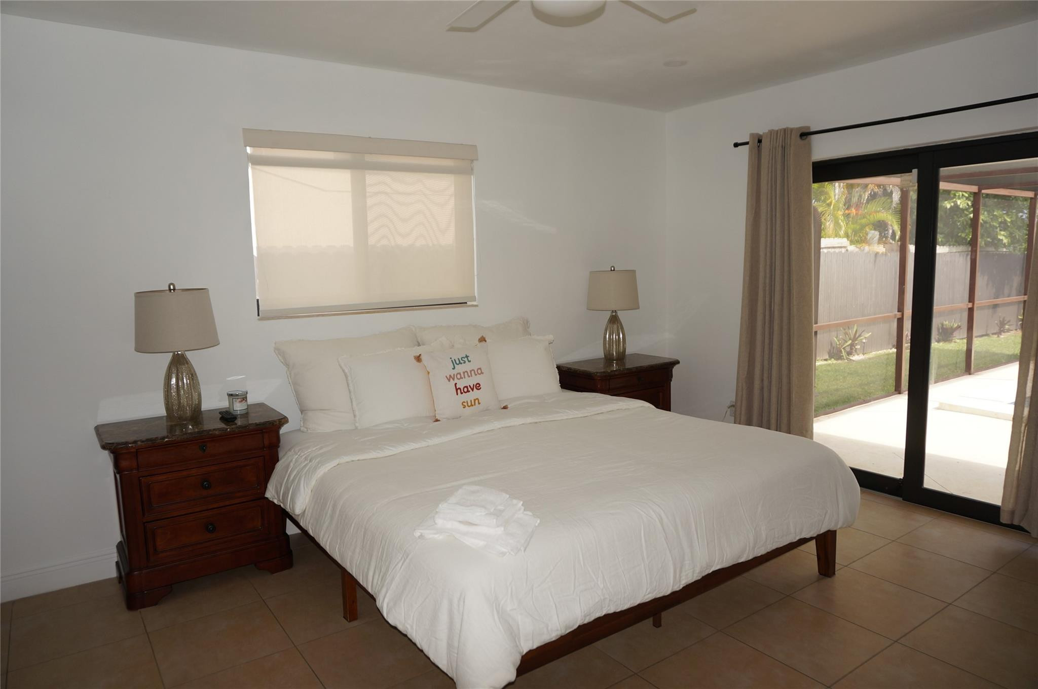 9220 Southwest 56th Street Miami, FL 33165 - Photo 12 of 23 a bedroom with a bed and window