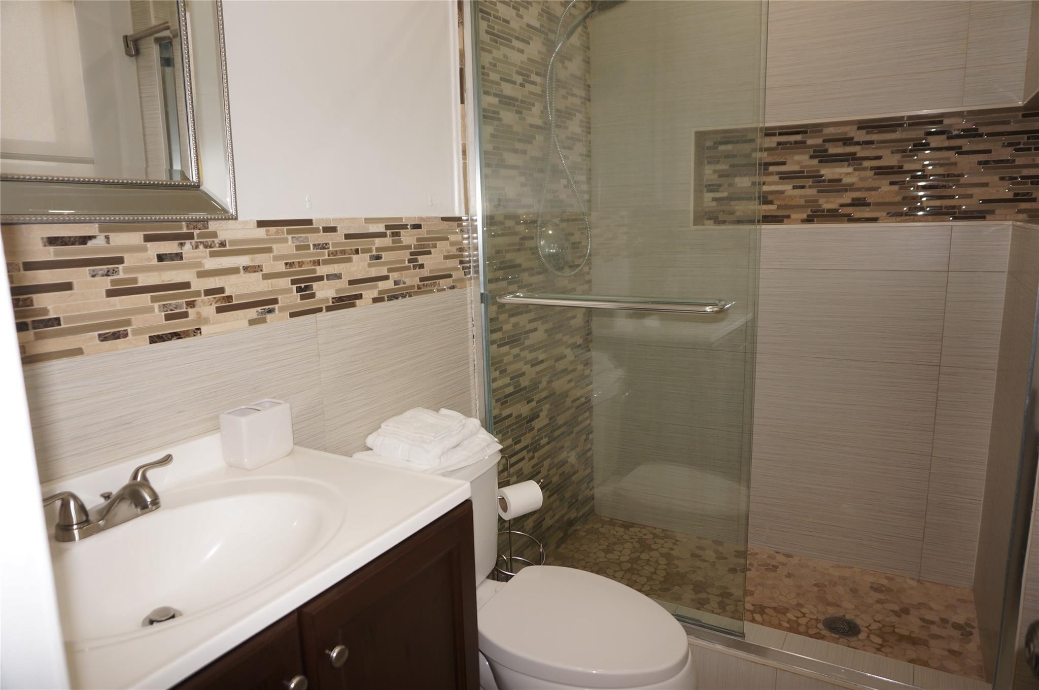 9220 Southwest 56th Street Miami, FL 33165 - Photo 15 of 23 a bathroom with a sink a toilet and shower