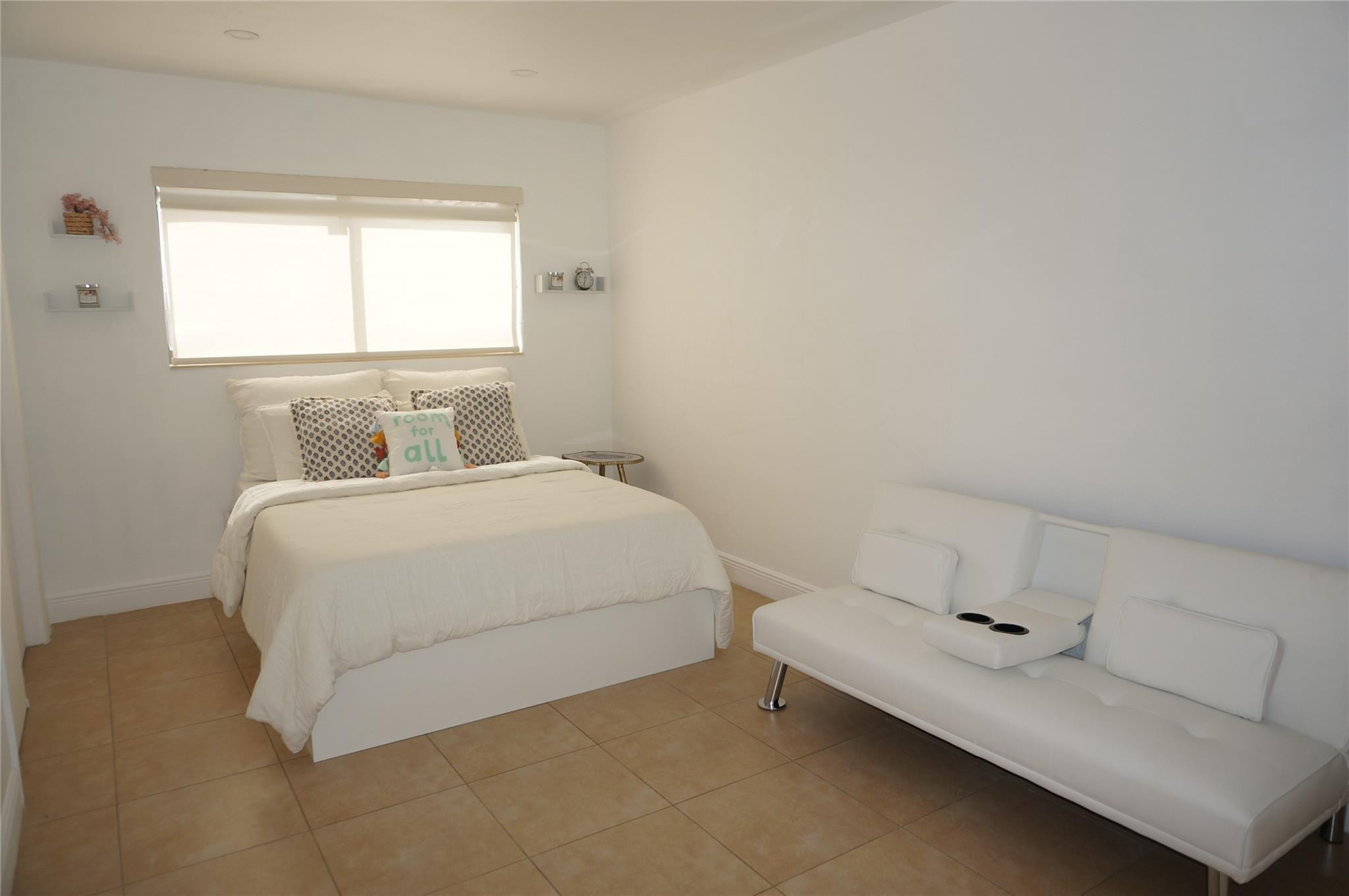 9220 Southwest 56th Street Miami, FL 33165 - Photo 16 of 23 a bedroom with a bed and window