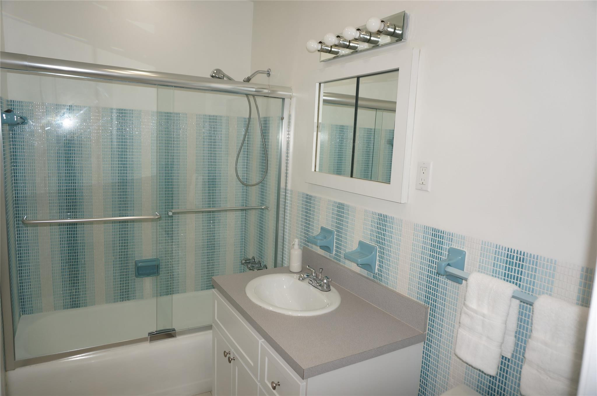 9220 Southwest 56th Street Miami, FL 33165 - Photo 18 of 23 a bathroom with a sink a toilet and shower