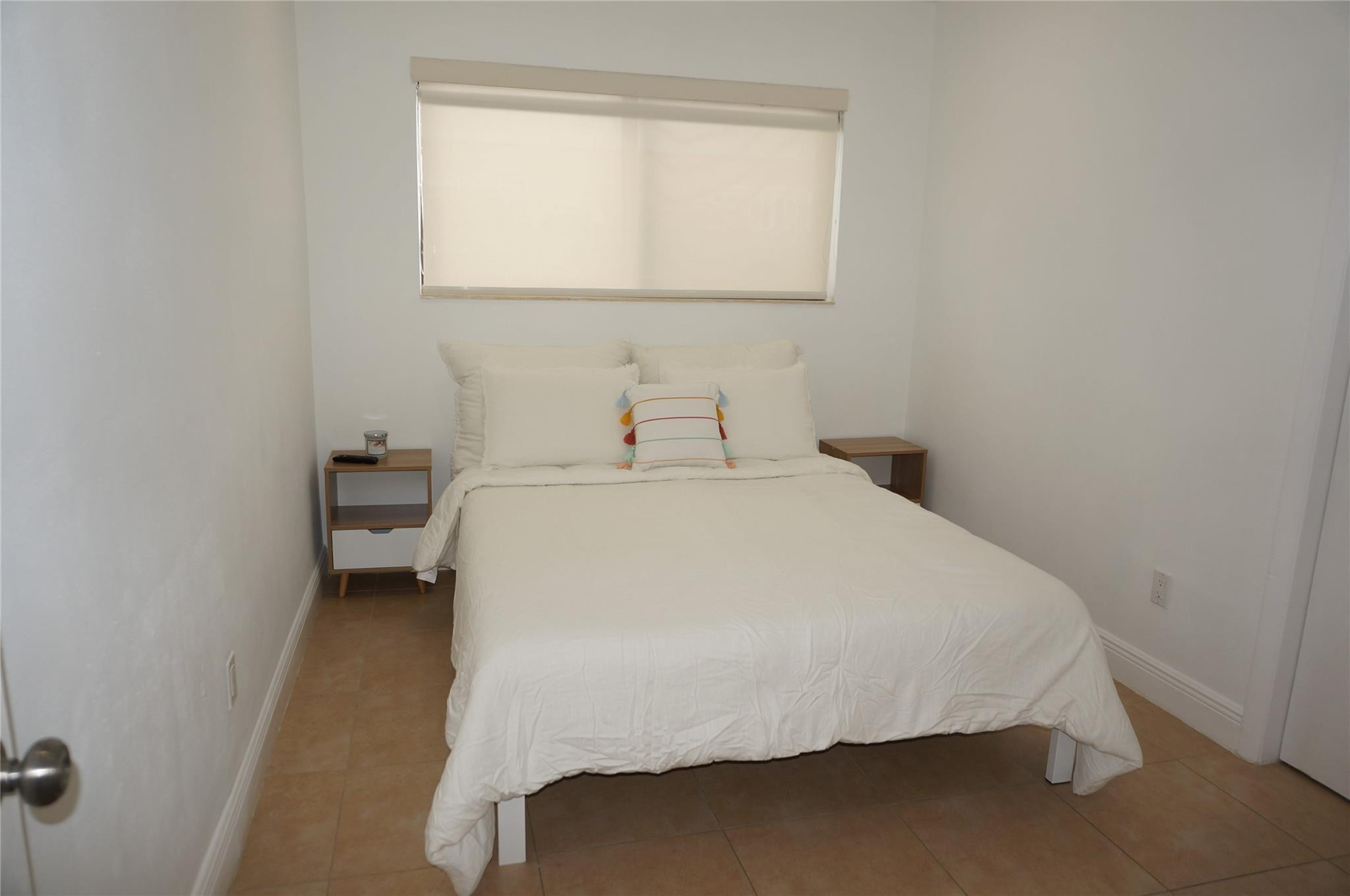 9220 Southwest 56th Street Miami, FL 33165 - Photo 19 of 23 a large bed sitting in a bathroom next to a window