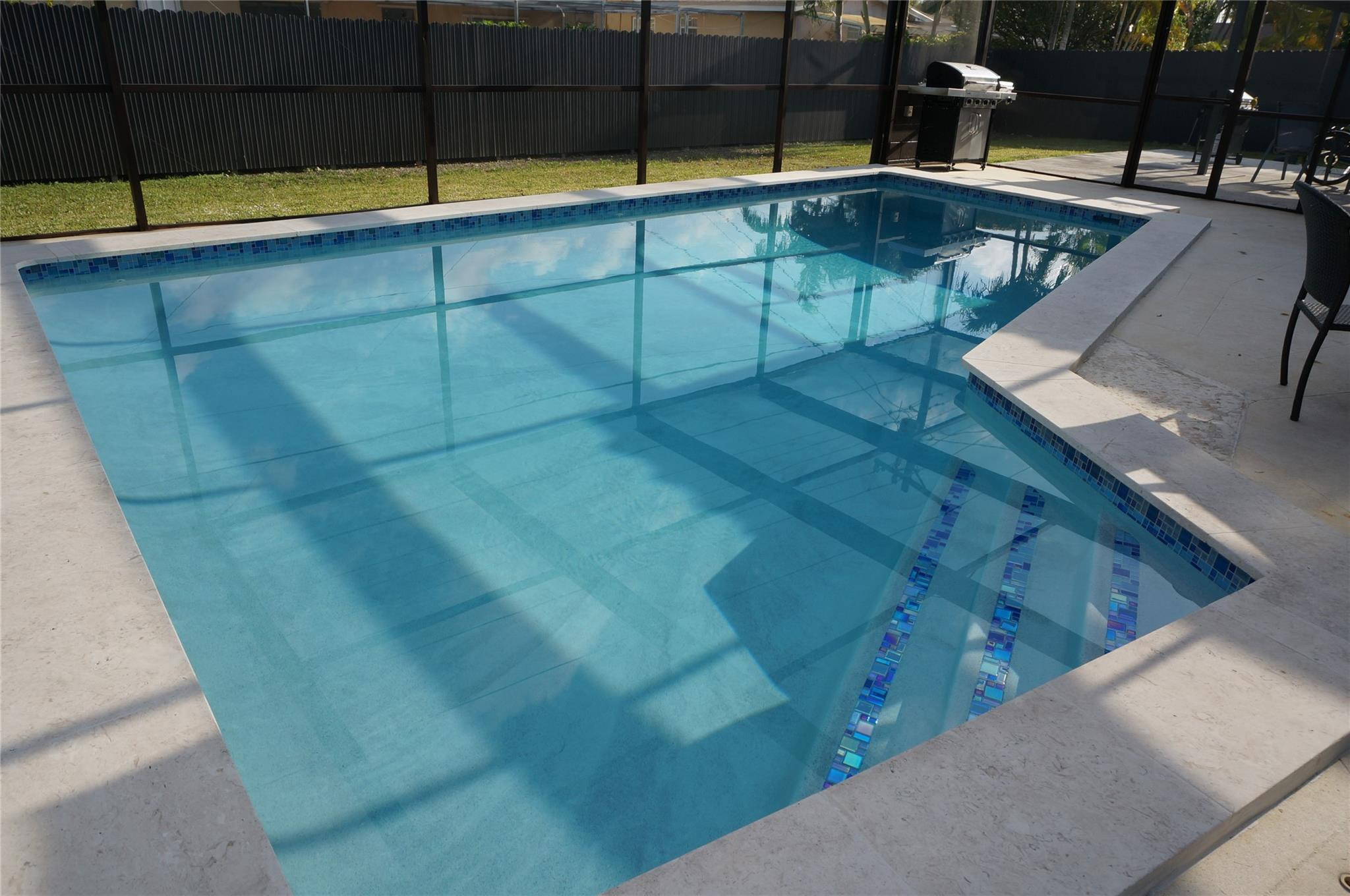9220 Southwest 56th Street Miami, FL 33165 - Photo 22 of 23 a view of a swimming pool with a chair