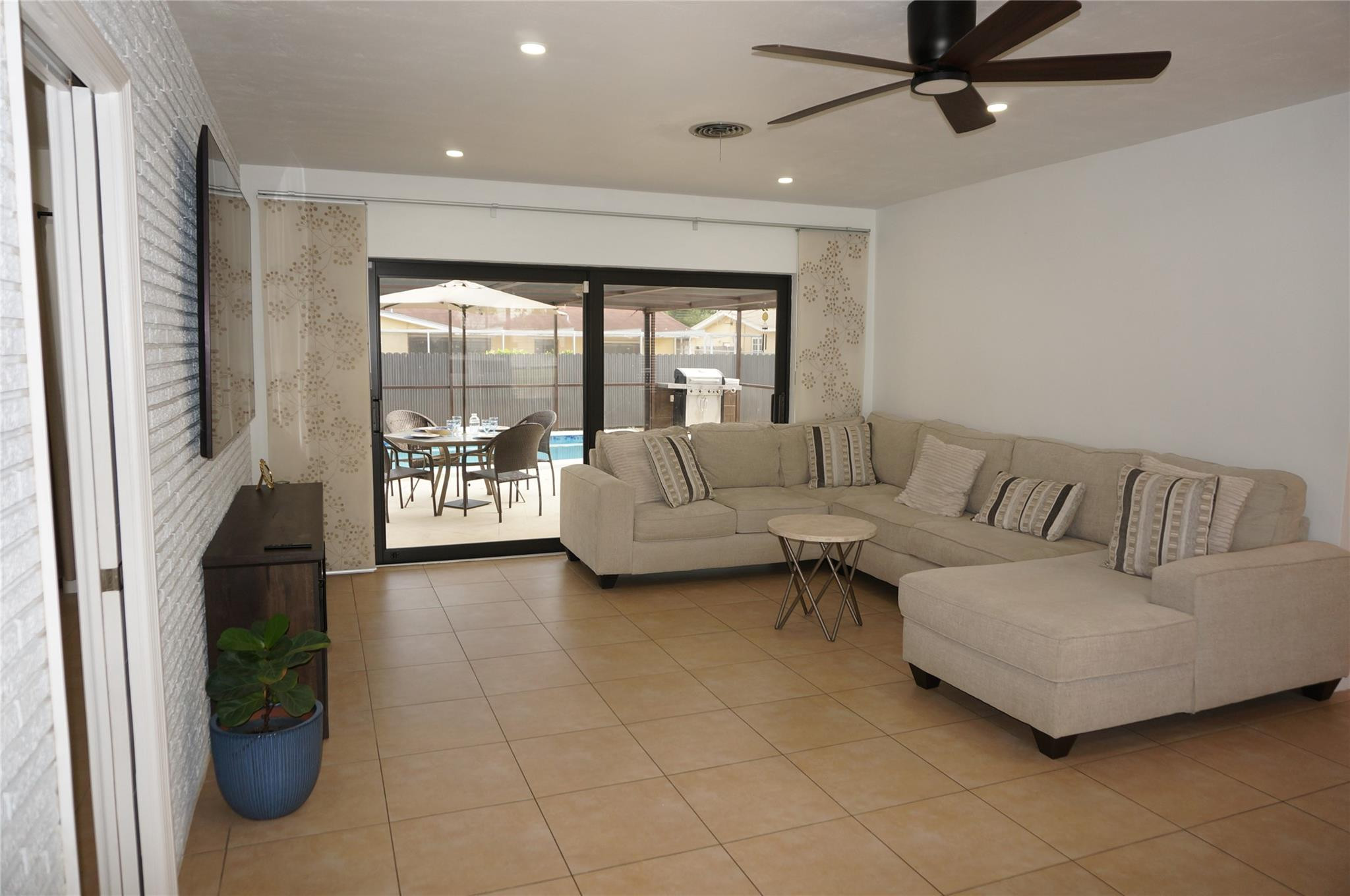 9220 Southwest 56th Street Miami, FL 33165 - Photo 6 of 23 a living room with furniture and a large window
