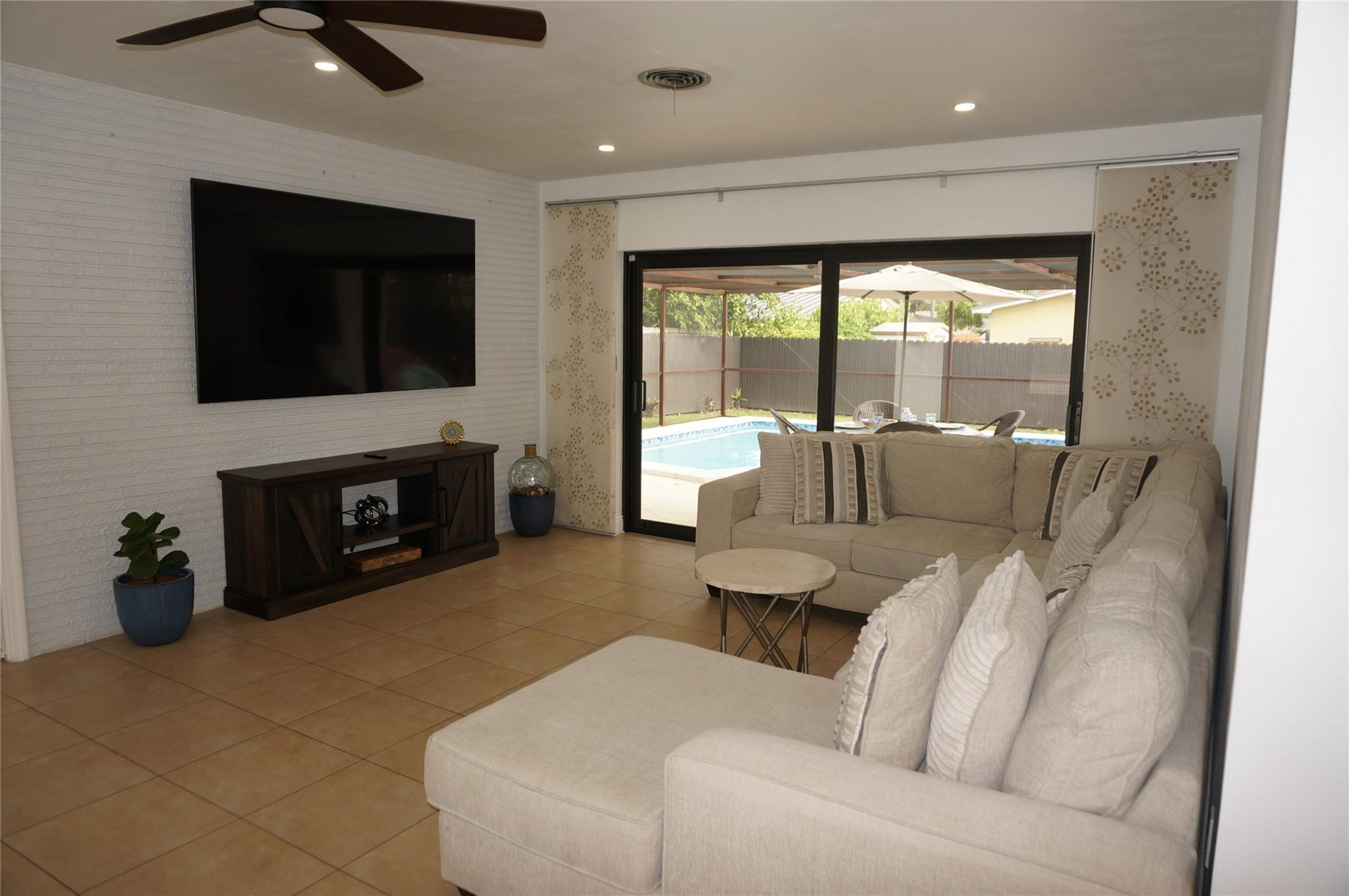 9220 Southwest 56th Street Miami, FL 33165 - Photo 7 of 23 a living room with furniture and a fireplace