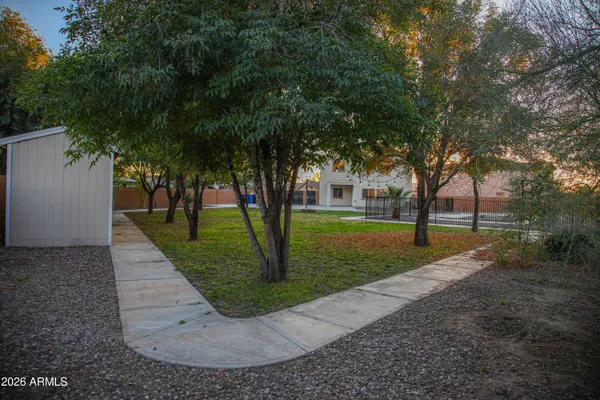 a backyard of a house with lots of green space