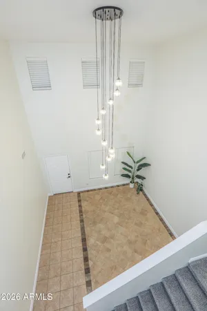 a spacious bathroom with double sink and a mirror