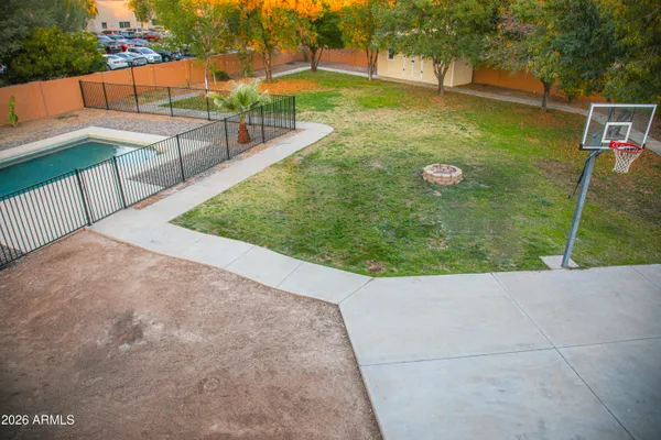a view of a backyard with floor to ceiling window