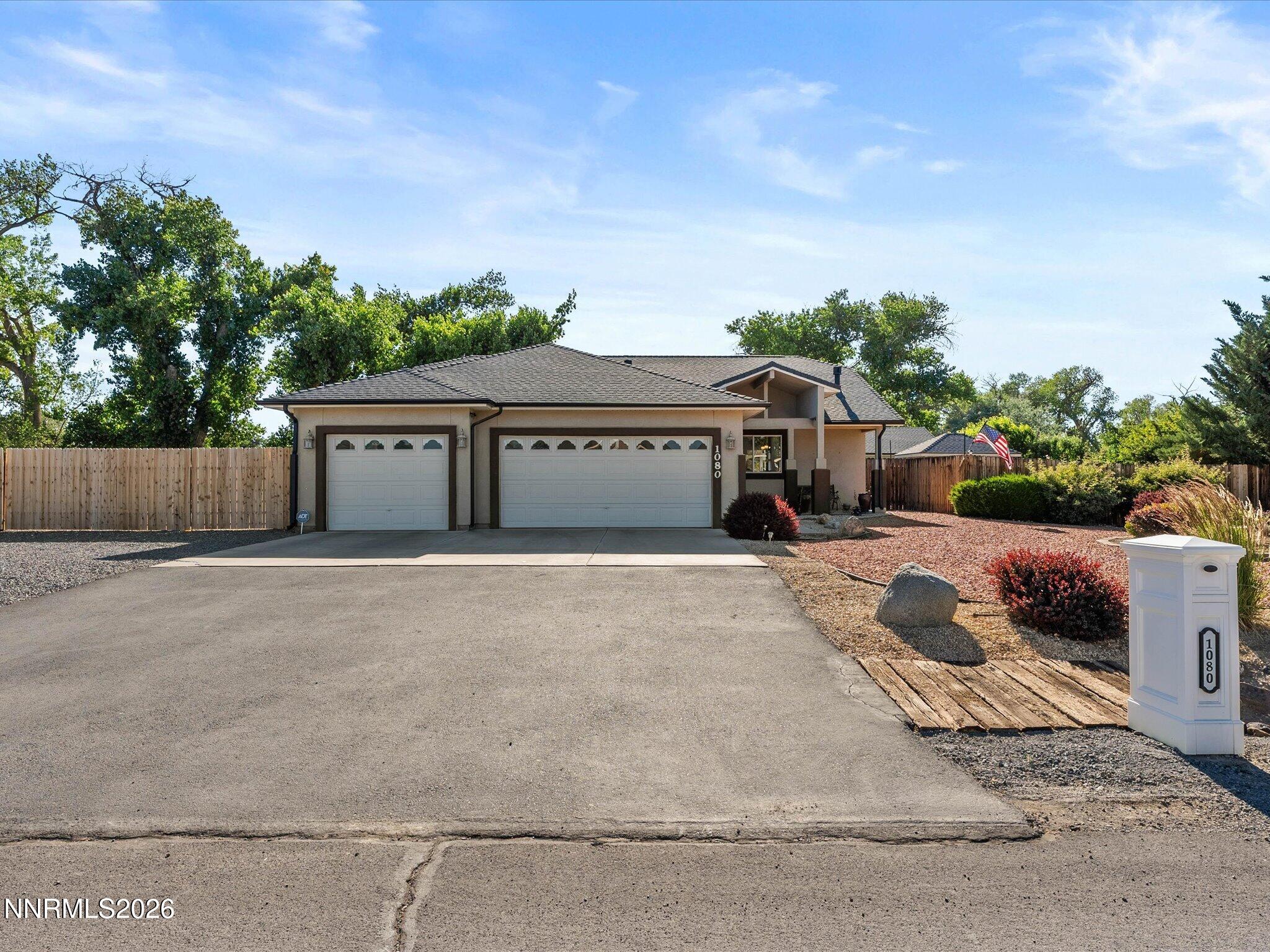 1080 Red Rock Road Fernley, NV 89408 - Photo 2 of 45 front view of a house with a yard