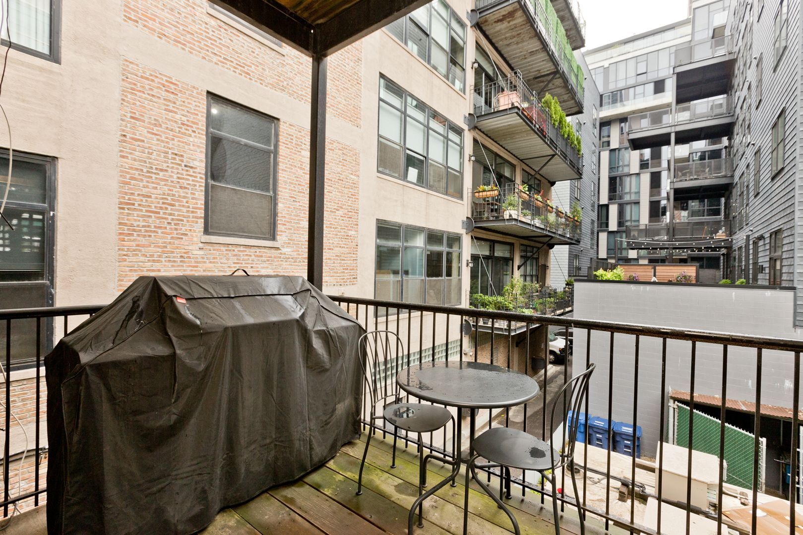 842 West Adams Street, Unit 3 Chicago, IL 60607 - Photo 12 of 12 a balcony with table and chairs