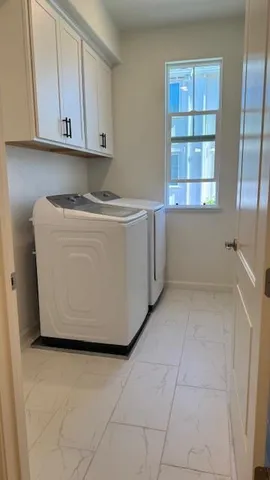 a room with a cabinet and a window