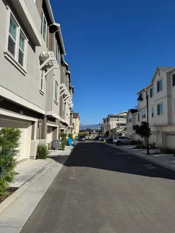 a view of a street with a building in the background